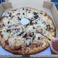 Vegan 12" pizza with dairy free cheese, plant-based meat and GF/vegan dough.   at Monroe Pizza & Pints in Monroe