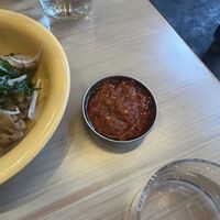 You can order the spicy sauce on the side  at Lion Dance Cafe in Oakland