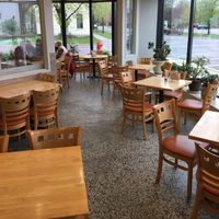 Indoor seating area. There is also outdoor seating. at Saint Peter Food Co-op and Deli in St Peter