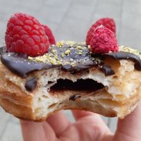 Crossnut with chocolate and raspberry, with chocolate filling at Royal Donuts in Kiel