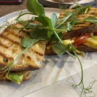 Avocado, cherry tomatoes, vegan cheese toastie with chilli jam. A good few options to choose between and plant based milks and smoothies. 😋 at Port Espresso in Brixham