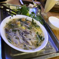 Hue style noodle dish with banana juice at Loving Hut - Âu Cơ in Hanoi