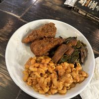 Vegan chicken Mac n cheeze and collard greens   at Vegan Hood in New York City