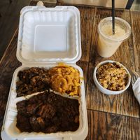 Ox tail, mac n cheese, collard greens, with side of rice and beans. Sour sop drink. at Vegan Hood in New York City