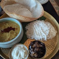 Aubergine Kari, coconut sambol, brinjal moju, hopper and string hoppers at Hoppers - King's Cross  in North London