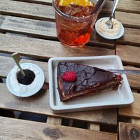 A piece of Chocolate Cake. at UNO Caffé Olistico in Bologna