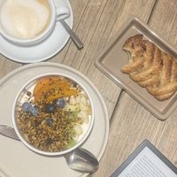 soy yoghurt with fruit and filled pastry   at UNO Caffé Olistico in Bologna