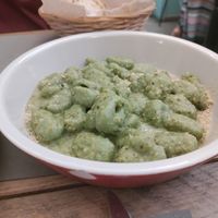 Hemp seed pesto gnocchi at UNO Caffé Olistico in Bologna