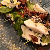 Bruschetta alla ricotta di mandorla at UNO Caffé Olistico in Bologna