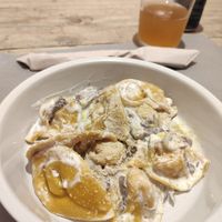 Pasta with pumpkin filling, shitake and vegan ricotta at UNO Caffé Olistico in Bologna