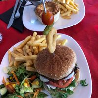 Vegan burger with vegan mayo and chickpea and tomato pie with chips, gravy and some veggies that came just after I took the pic 💗🌿 at Drivers Bar in Villamartin