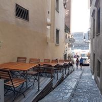 Outdoor seating in alley at Weisses Kreuz in Luzern