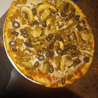 Vegan sausage, mushroom, and olive pizza ! at Zois Pizza in Seymour