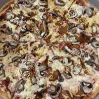 Vegan cheese, vegan pepperoni, mushroom  at Zois Pizza in Seymour