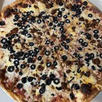 Vegan cheese, vegan chorizo, olive  at Zois Pizza in Seymour