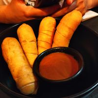 Tequeños rellenos de chocolate y para mojar at Cerveceria La Raposa in Oviedo