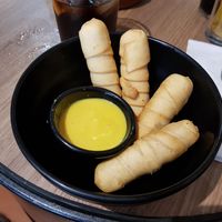 Tequeños with sweet mustard at Cerveceria La Raposa in Oviedo