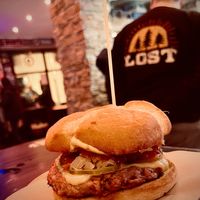 Damn bastard burger: D'arbeyu protein burger with "honey mustard", fried onion, tomato, sauerkraut, pickles, "cheese", ketchup at Cerveceria La Raposa in Oviedo