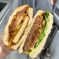 Delivered juicy vegan burgers: U.H.P. (left) and 1.3.1.2. at Cerveceria La Raposa in Oviedo