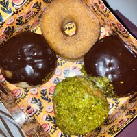 the picture is bad but 2 boston creams are great, pistacchio and cinammon just pure sugar bomb at Brammibal's Donuts - Alexanderplatz in Berlin