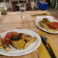 Greek dish, baked bell pepper and tomato filled with rice and served with potatoes. at Mom's Kitchen in Kos
