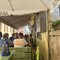 Outdoors with a nice breeze. Taverna style on a Narrow street   at Mitato Grill in Nafplion