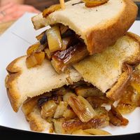Sausage, fak'n and onion sandwich.... at The Vegan Street Food Company in Worthing