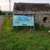 Sign by the road at Bo Thai Takeaway in Penzance