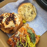 Savory Rolls & Tomato Focacia (on the left is The Chili Oil Roll... So Good!)  at The Easy Vegan - Food Truck in Denver