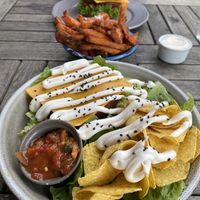 A very delicious vegan salad and a vegan burger with a share sweet potato fries with vegan mayo on the side. Love this 🥰  at Halifax Burgers in Koege