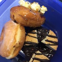 In own container: sugar coated , caramelized popcorn, double cookie chocolate  at Royal Donuts - Stuttgarter Str in Stuttgart