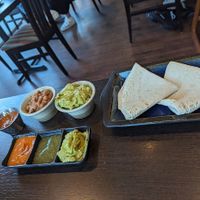 All the trimming that come with fajitas, plus extra refried beans ands avocado at Amigos Mexican Kitchen in Sheffield