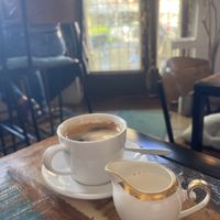 Coffee with oat milk  at Cafe Bar Armer Ritter in Cologne