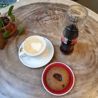 Cappuccino with oatmilk, chocolate cookie, cola at Fixed Gear Coffee in Maastricht