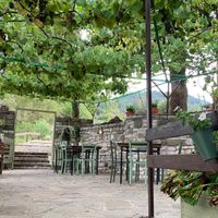 The terrace beneath the vines at  Pineapple Papingo - Κουκουνάρι Πάπιγκο in Papingo