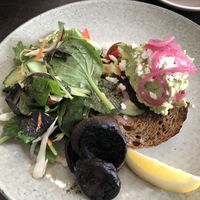 Smashed avocado on Kapiti grain toast with side of mushrooms  at Otaki Kitchen in Otaki