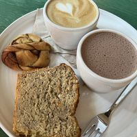 Banana bread, cinnamon roll, cappuccino and hot chocolate   at SUEDHANG in Tubingen