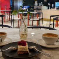 Coconut cake plus two delicious coffees, super happy with this place! at Kafé Plattan in Stockholm
