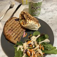 We shared a grilled tofu banh mi sandwich and  a grilled teriyaki “chicken” wrap.   at Kafé Plattan in Stockholm