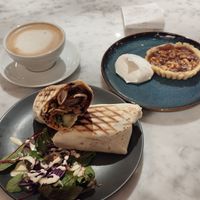 Chicken Teriyaki wrap, caramel walnut tart and Oatmilk Cappuccino at Kafé Plattan in Stockholm