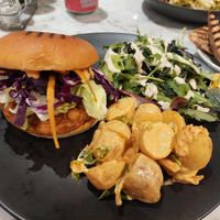 Tempeh burger, potato salad, salad. at Kafé Plattan in Stockholm