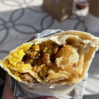Tofu Scramble+potatoes+chorizo sausage= Vegan Breakfast Burrito  at FeelLove Coffee in Springdale