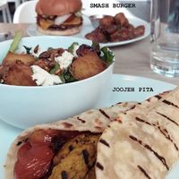 Smash burger & joojeh pita 🌱 at MILA in Vancouver