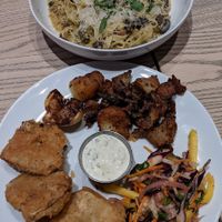 Mushroom and Sausage Tagliatelle (top) and Celeriac Fish and Chips at MILA in Vancouver