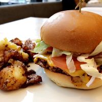 Burger, potatoes  at MILA in Vancouver
