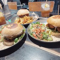 We took 3 burgers to share! The Ban Mi Burger is our favorite! But also the black bean and chicken burger was crazy good 😍🤤  at Vrutal - Poblenou in Barcelona