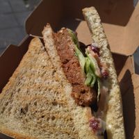 Vegan croque with burger and red beet bacon at Cropains in Bruges