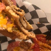Mid meal on the what the cluck and the chili cheese fries. Overall tasty but some spicy flavor would’ve been ideal.  at Mike's Vegan Cookout in Raleigh