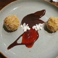 Plum dumplings with chocolate sauce at Hummelbude in Essen