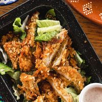 Caesar salad with KFC and insanely delicious dressing! at Plantivoros in Playa Del Carmen